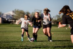 Students playing soccer